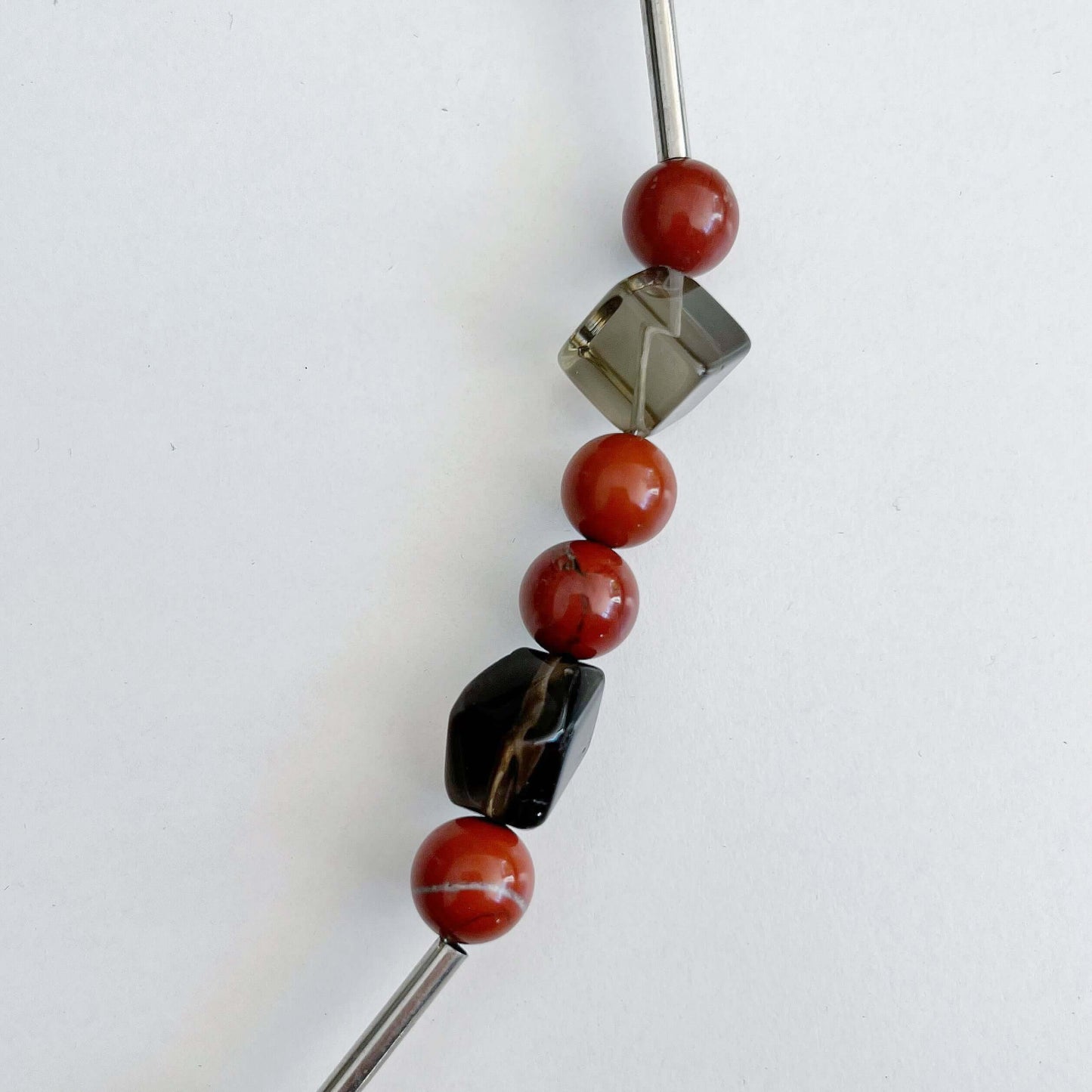 Detail view of the Red Jasper and Smokey Quartz beads.