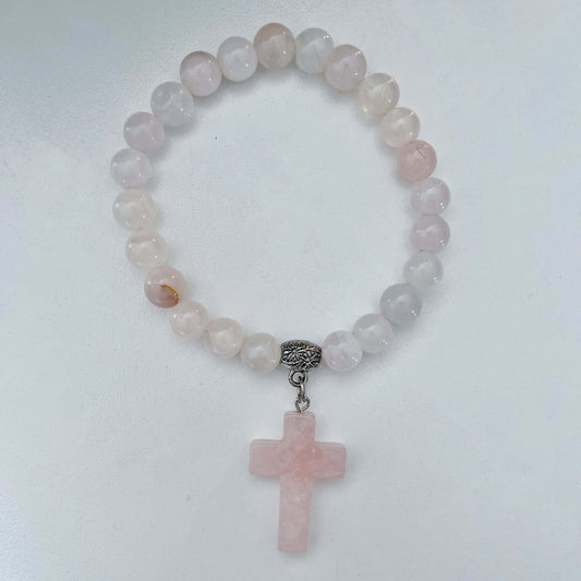 Top view of beaded bracelet with matching Rose Quartz cross.