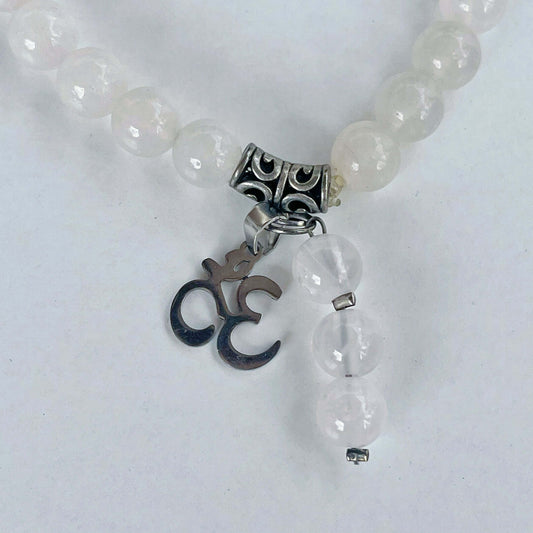 Detail view of the bracelet, with Om Sign and 3-bead dangle.