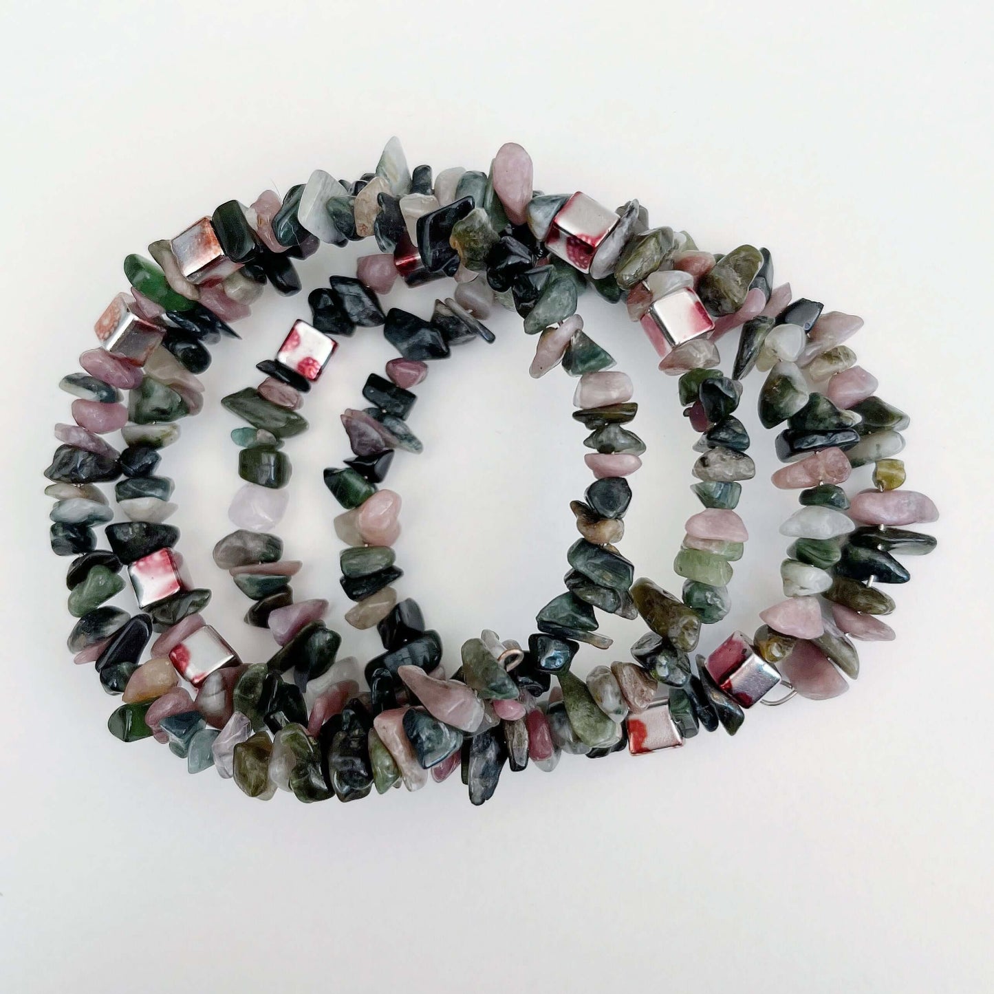 Top view of bracelet, in a gorgeous mixture of differing shades of green and pink tumbled Tourmaline chips.