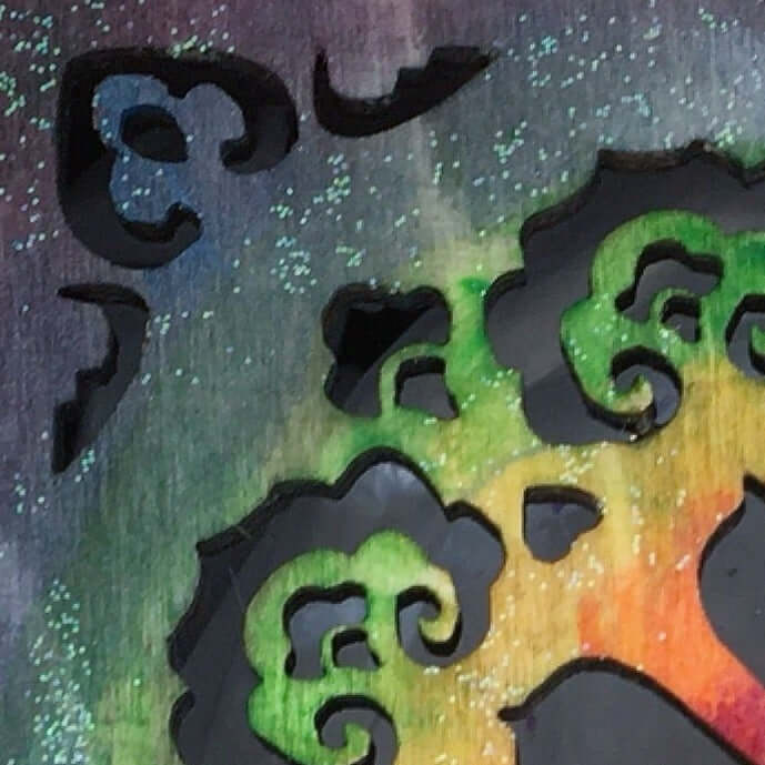 Detail close up view of rainbow painting style. fading from purple into red and orange.