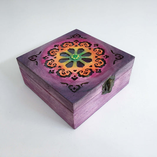 Outside view painted purple box, blending into rainbow shades on laser-cut lid, in ornate circular pattern, metal clasp.