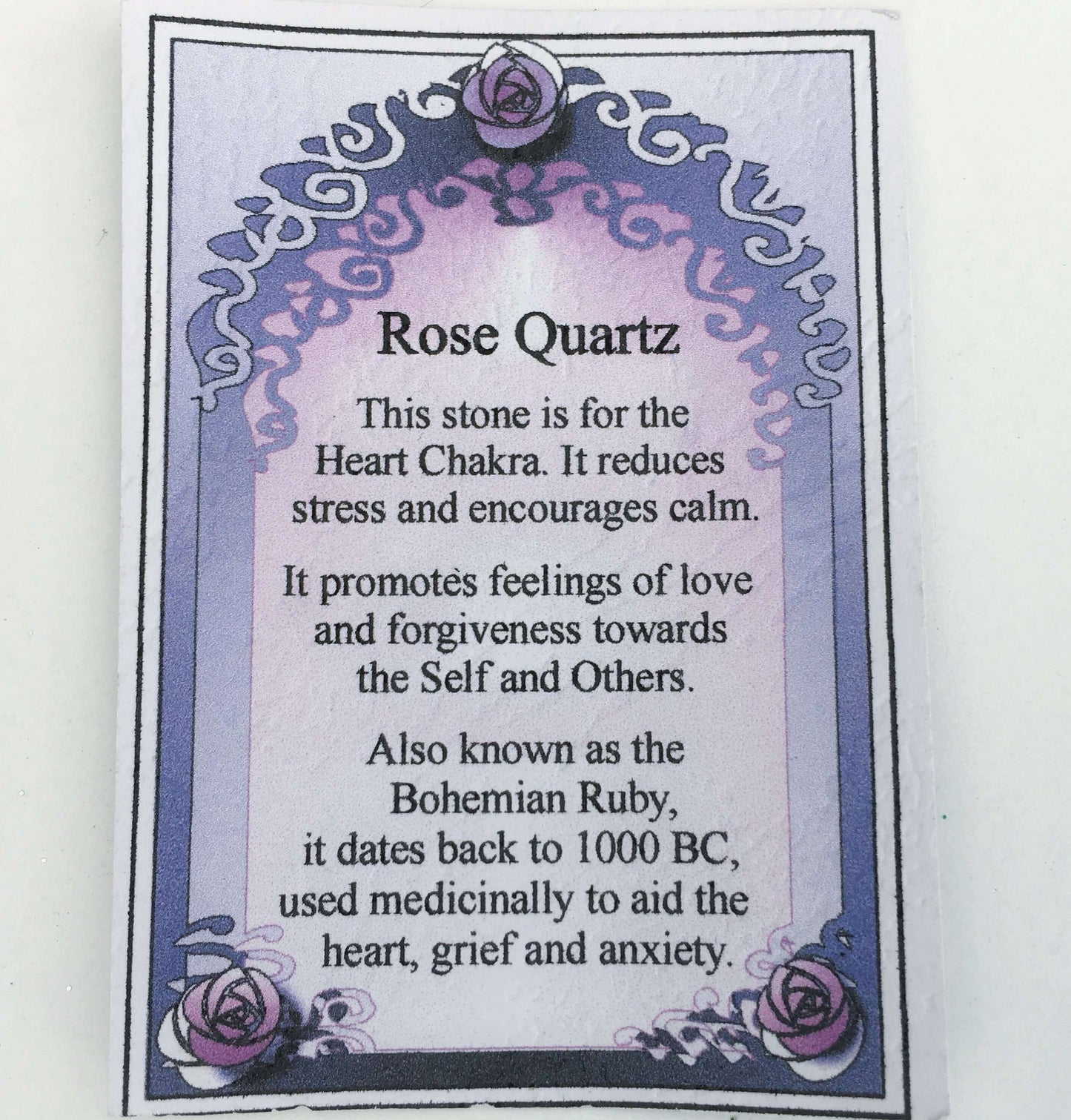 View of accompanying rose quartz write up which is on a little card in the box.
