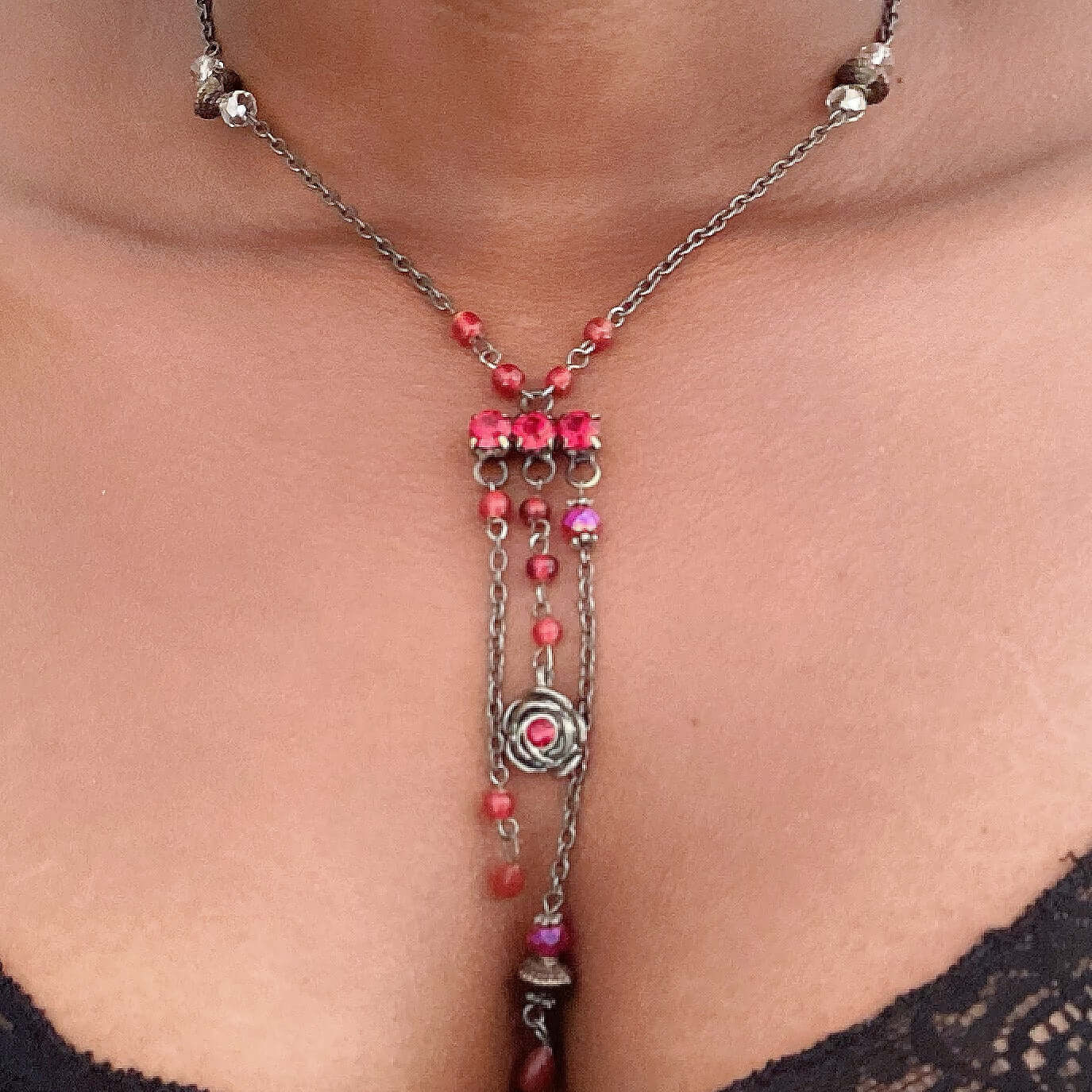 Y shaped chain necklace, red crystal stations, then central red crystal cluster, 3 shorter chains dangling from center.