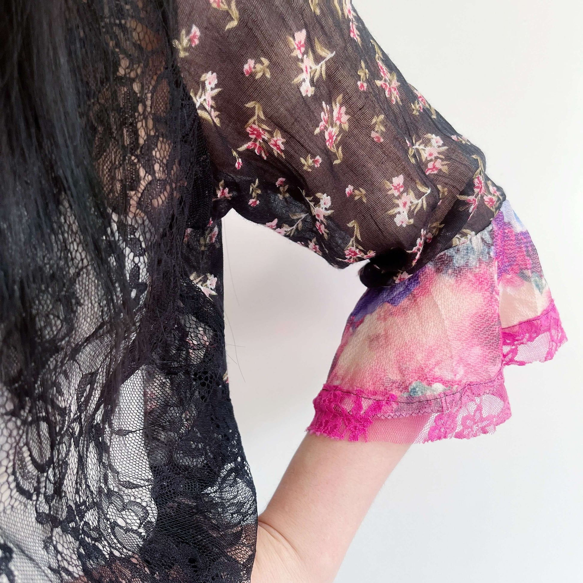 Front detail of left side with black lace front, and printed cotton sleeve, pink sleeve frill.