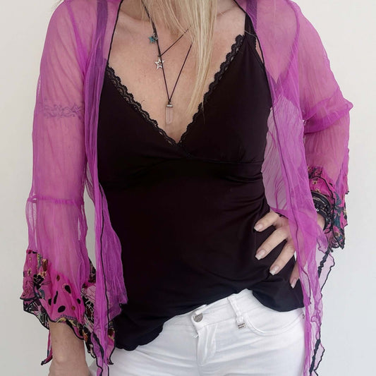 Close up of view fuchsia net tie top, worn loose.