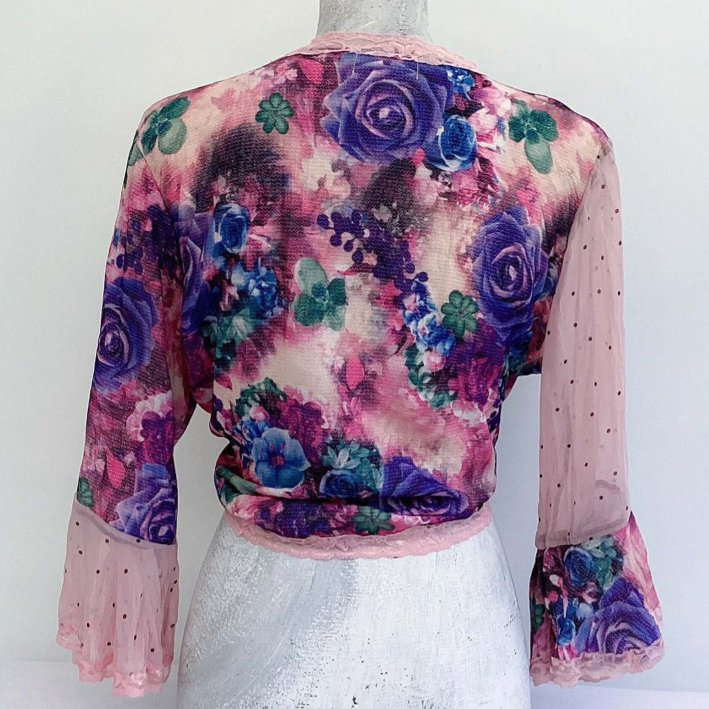 Back view of tie top, floral georgette, chiffon right sleeve, georgette left sleeve.