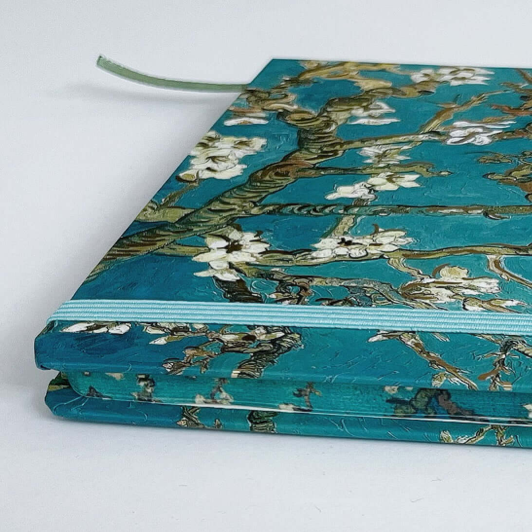 Side view of the journal, showing the facing pages also printed with artwork.