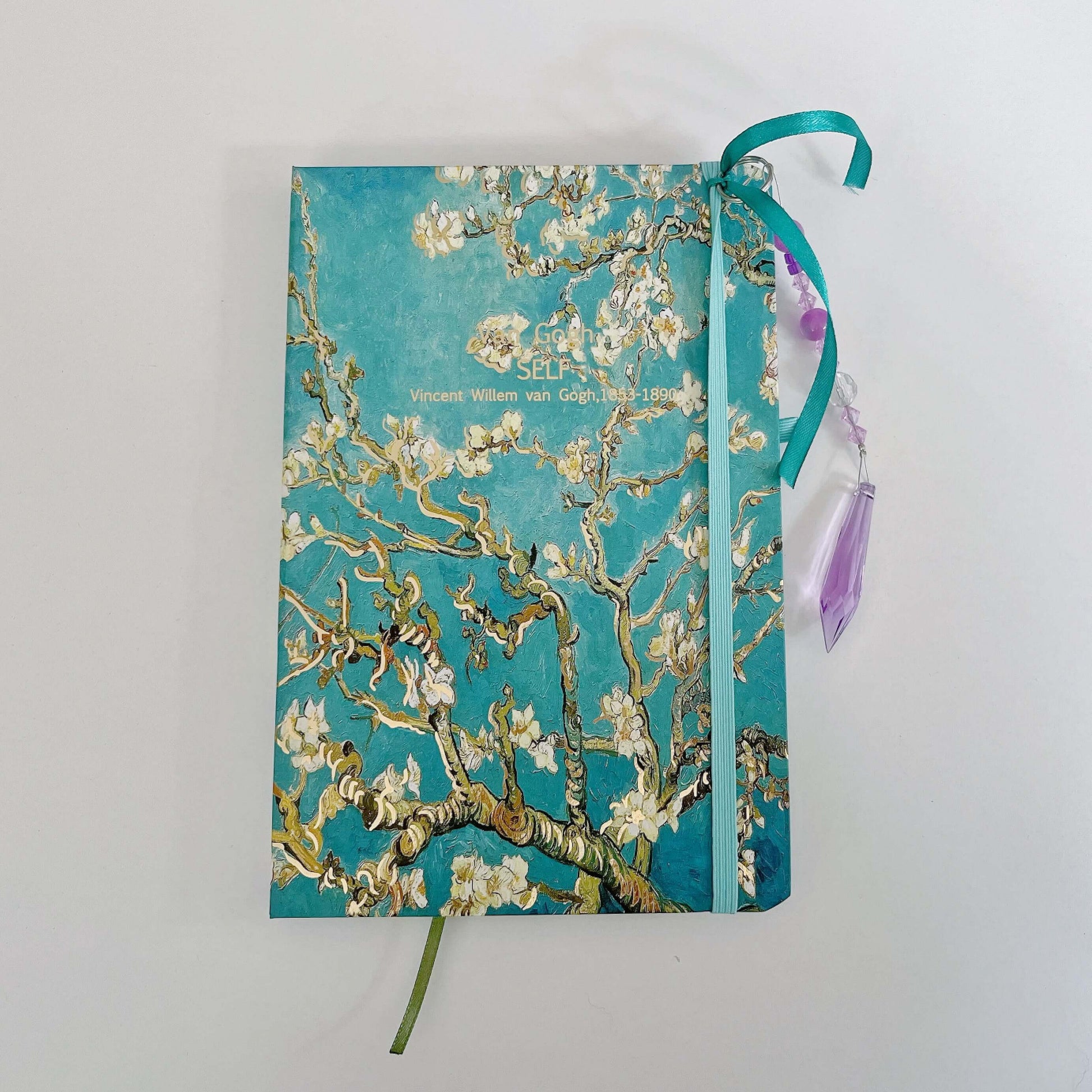 Top view of journal showing both the elasticated book mark and the beaded one. 