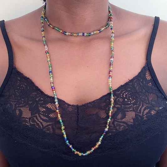 Zulu necklace worn doubled around the neck, alternating multi color translucent beads, approximately 3mm beads.